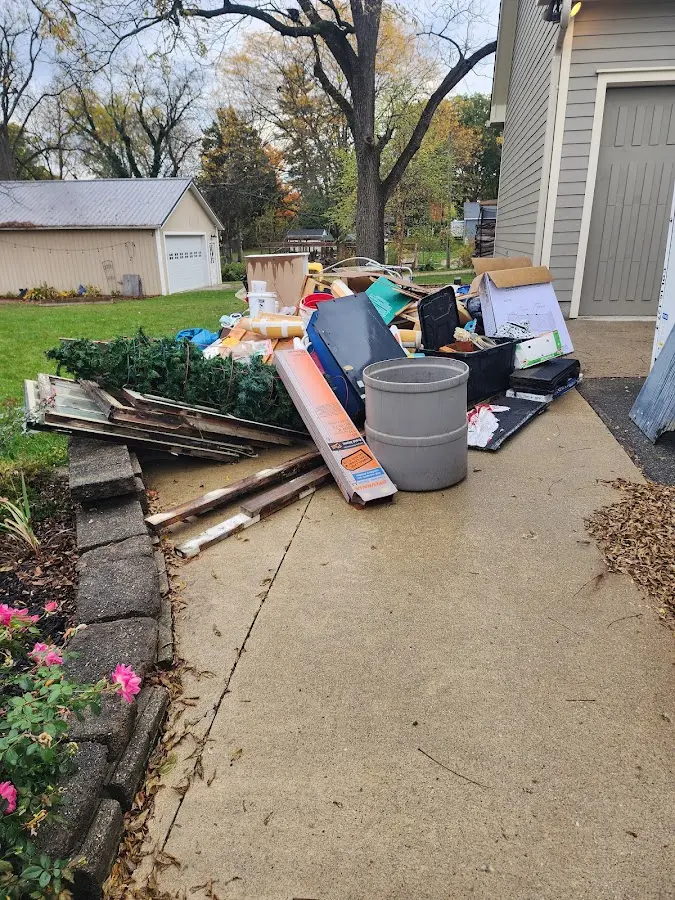 Dumpster being loaded with debris for 30 Yard Dumpster Rental in De Pere